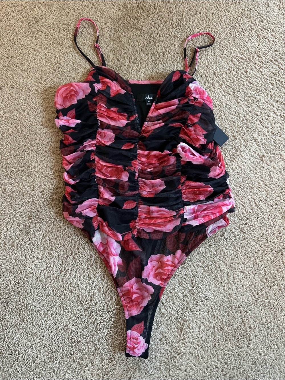 Lulu's Black Bodysuit with Pink Rose Accents.